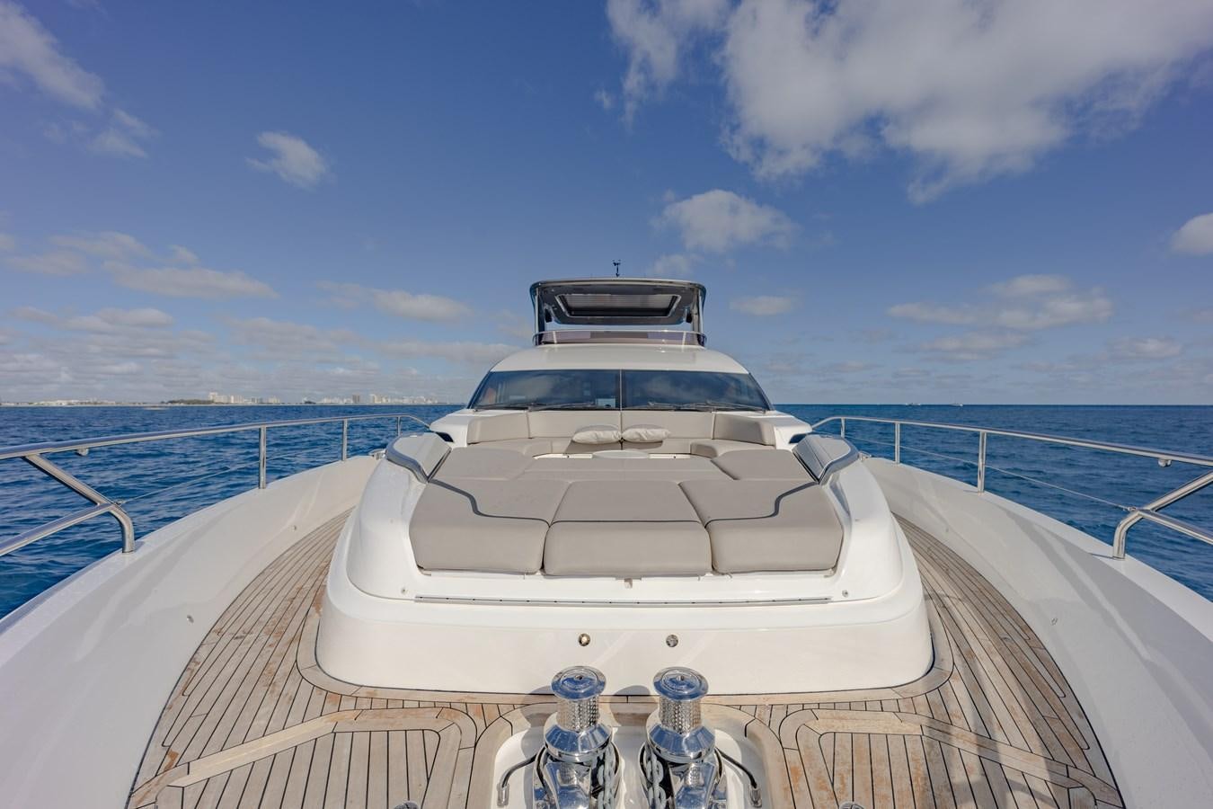 a white car on a boat aboard ESCAPEMENT Yacht for Sale