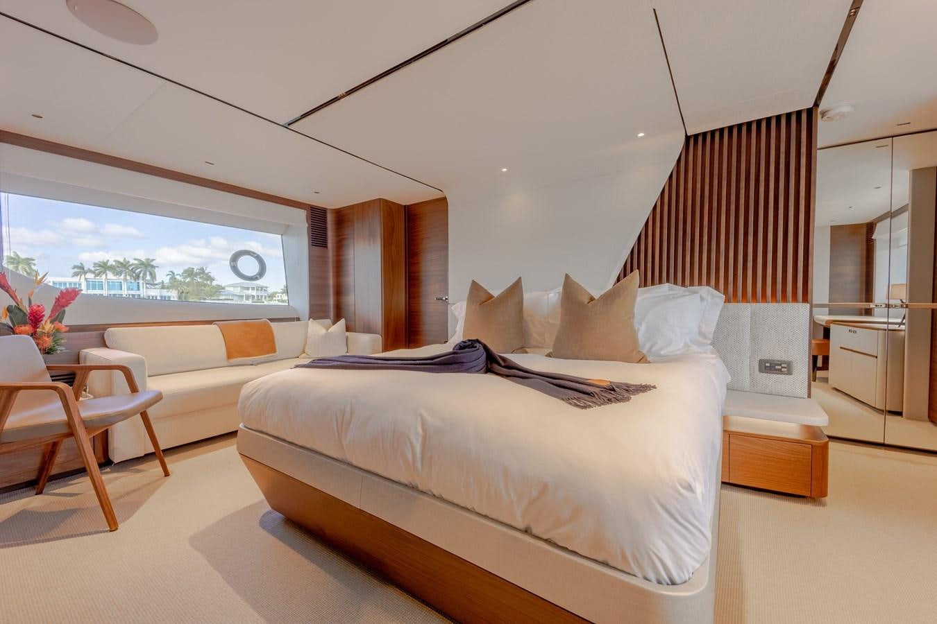 a room with a bed and a window aboard ESCAPEMENT Yacht for Sale