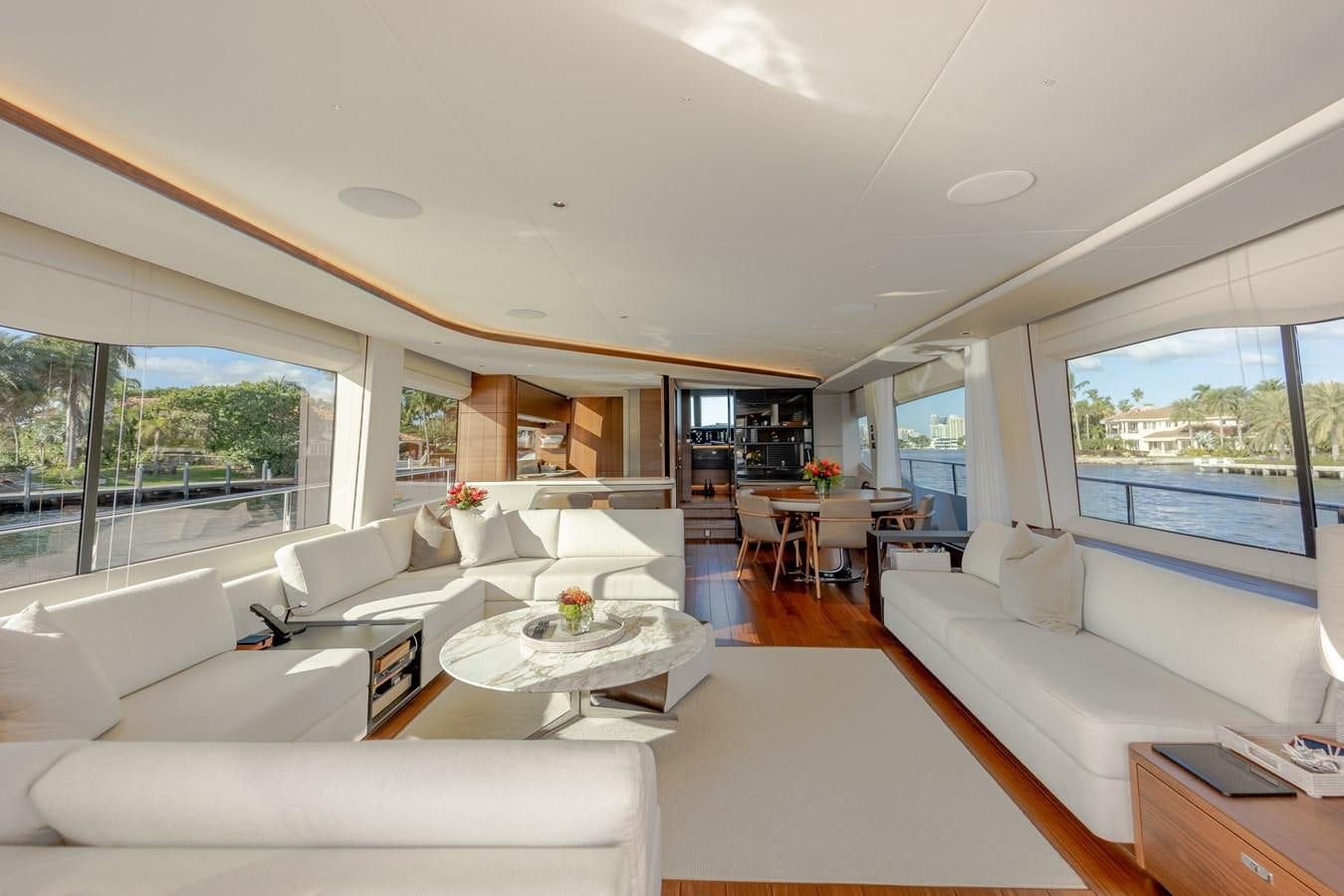 a living room with a large window aboard ESCAPEMENT Yacht for Sale