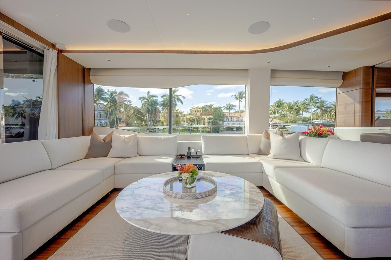 a living room with a large window aboard ESCAPEMENT Yacht for Sale