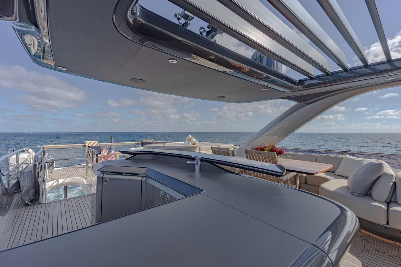 a deck with a view of the ocean and the deck aboard ESCAPEMENT Yacht for Sale