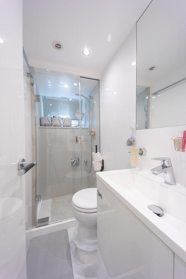 a bathroom with a glass shower aboard ESCAPEMENT Yacht for Sale