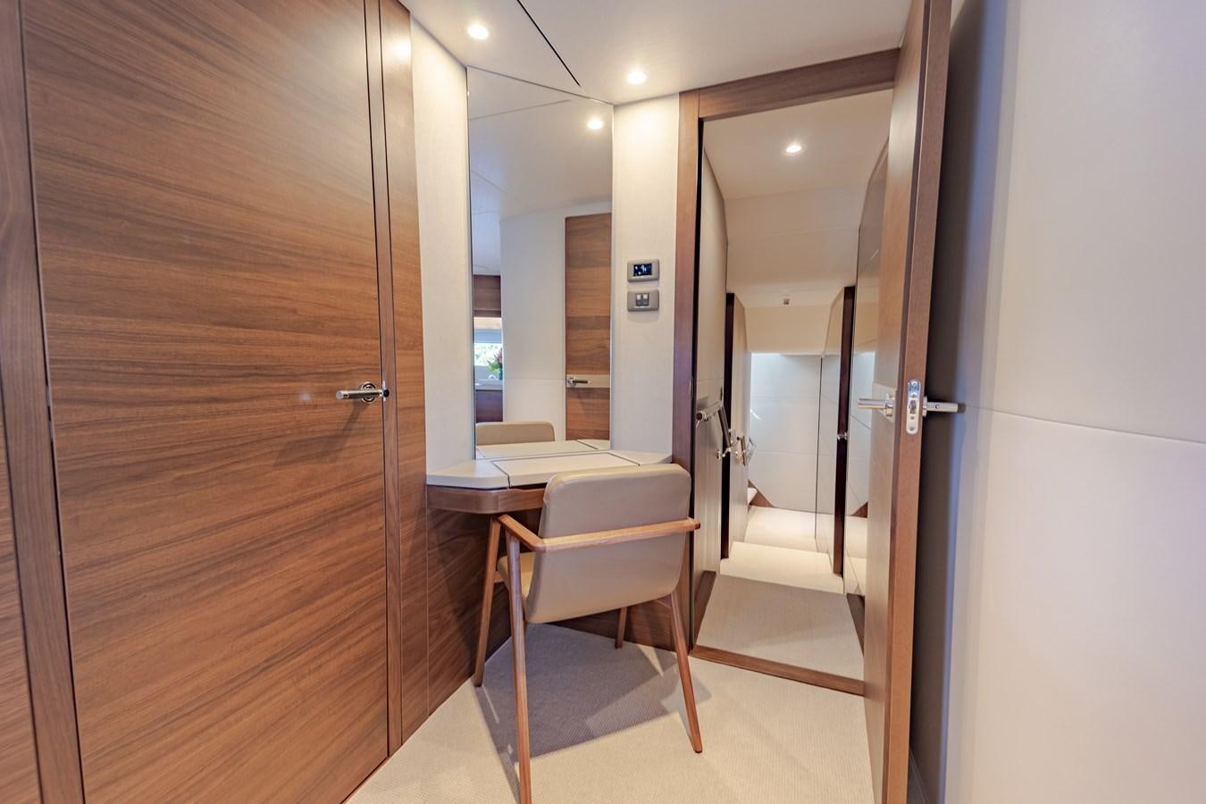a room with a desk and a door aboard ESCAPEMENT Yacht for Sale