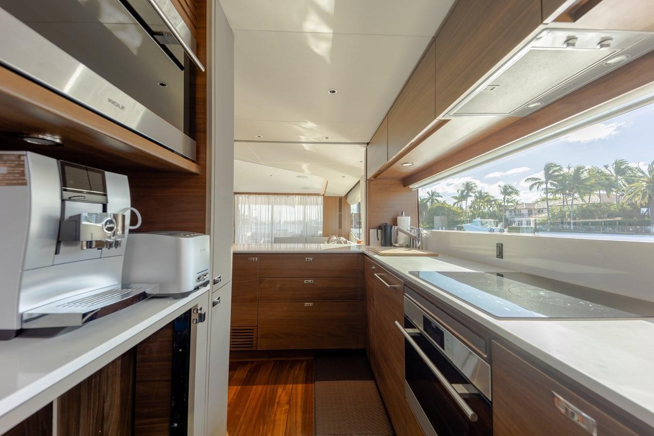 a kitchen with a large window aboard ESCAPEMENT Yacht for Sale