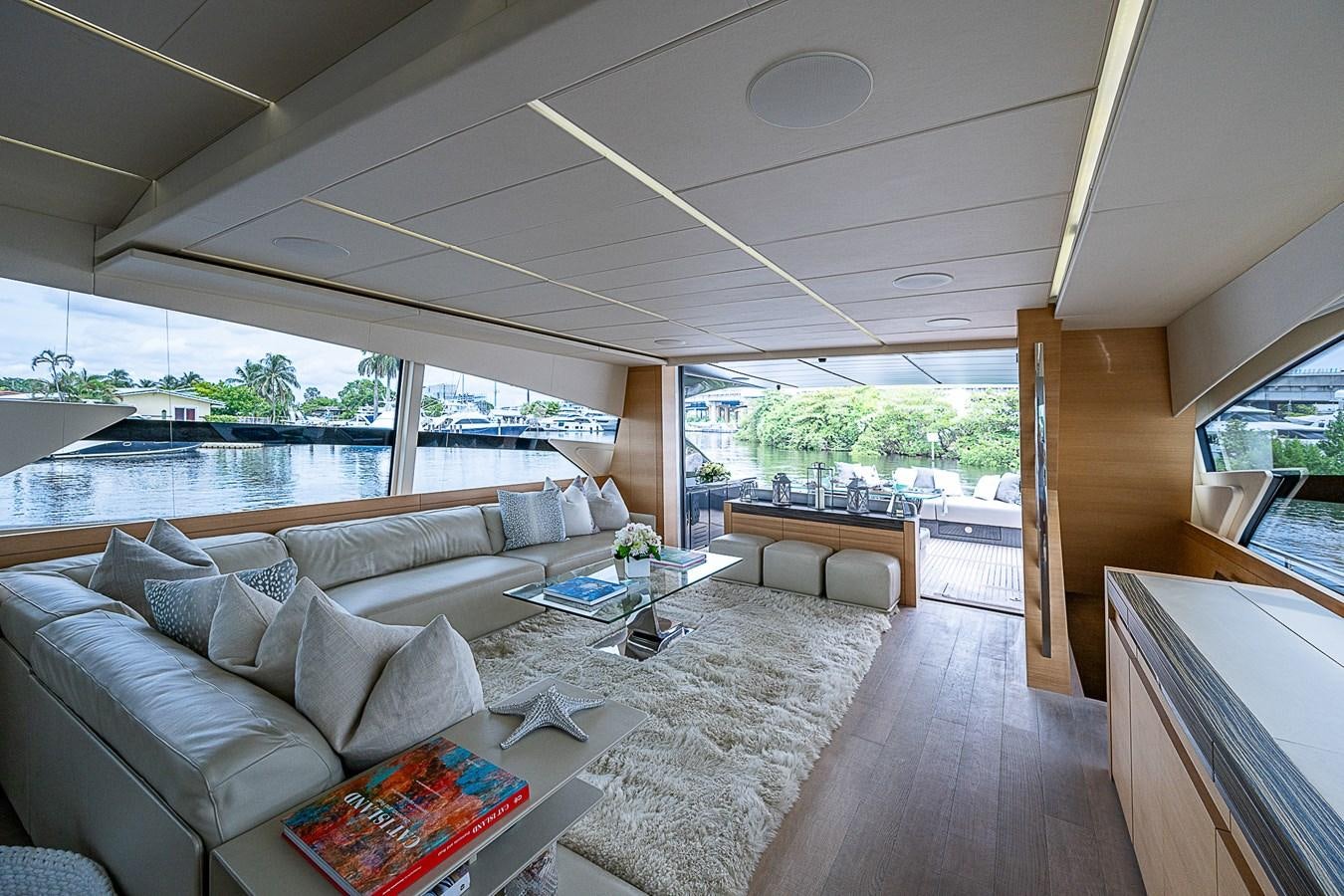 a living room with a large window aboard COAL BLOODED Yacht for Sale