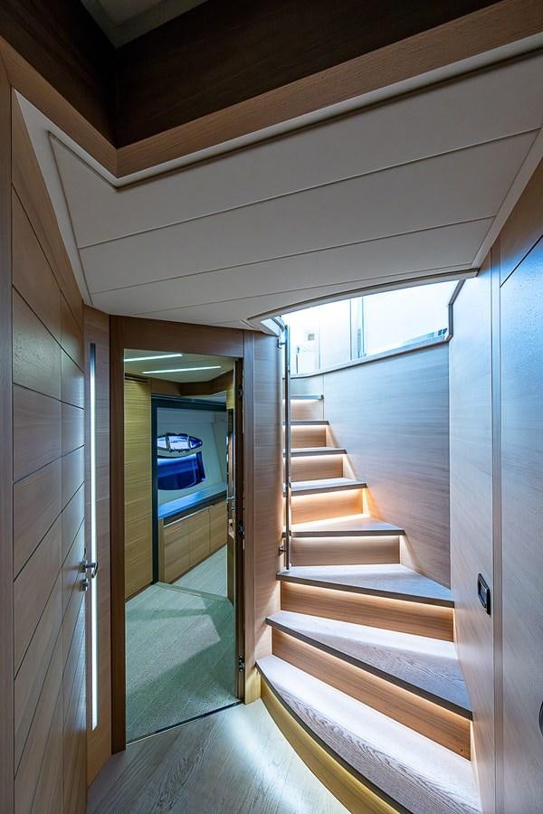 a room with a staircase and a window aboard COAL BLOODED Yacht for Sale
