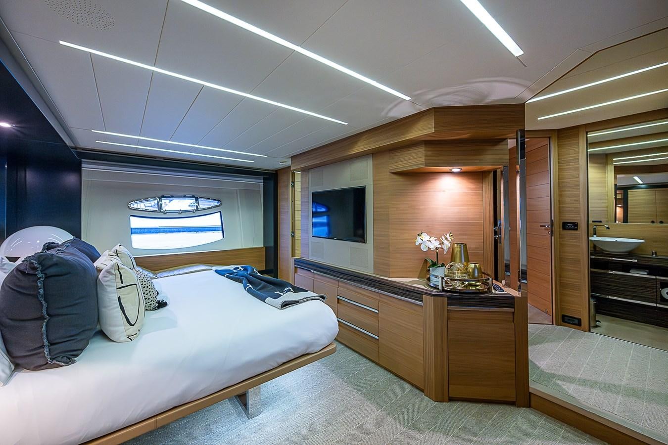 a bedroom with a bed and a desk aboard COAL BLOODED Yacht for Sale