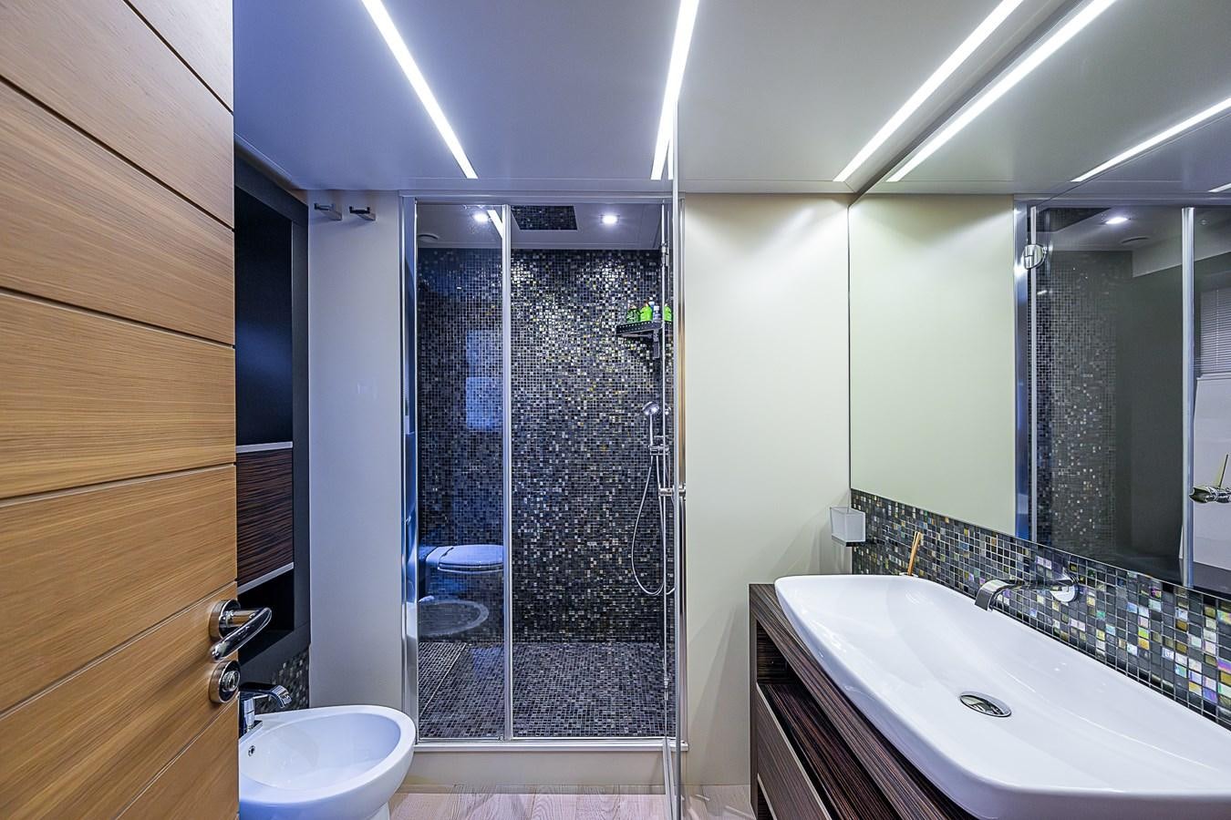 a bathroom with a glass shower aboard COAL BLOODED Yacht for Sale