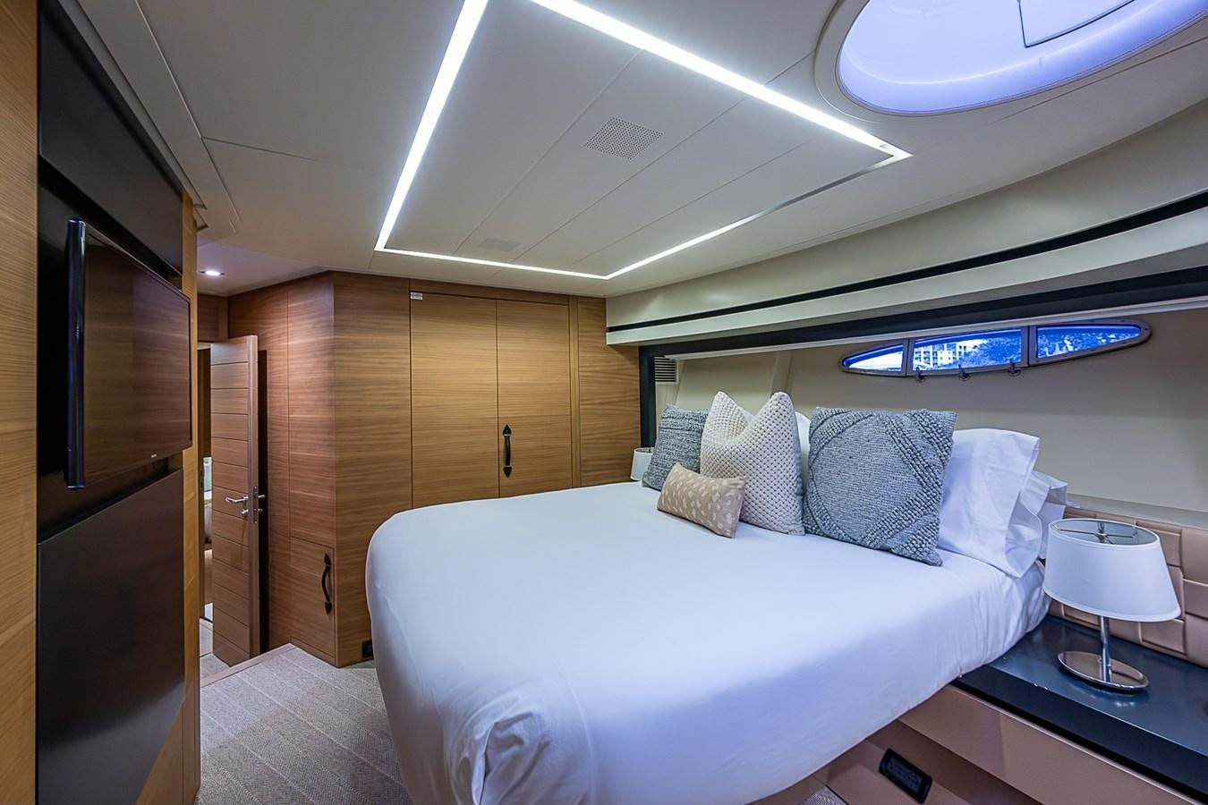 a room with a bed and a desk aboard COAL BLOODED Yacht for Sale