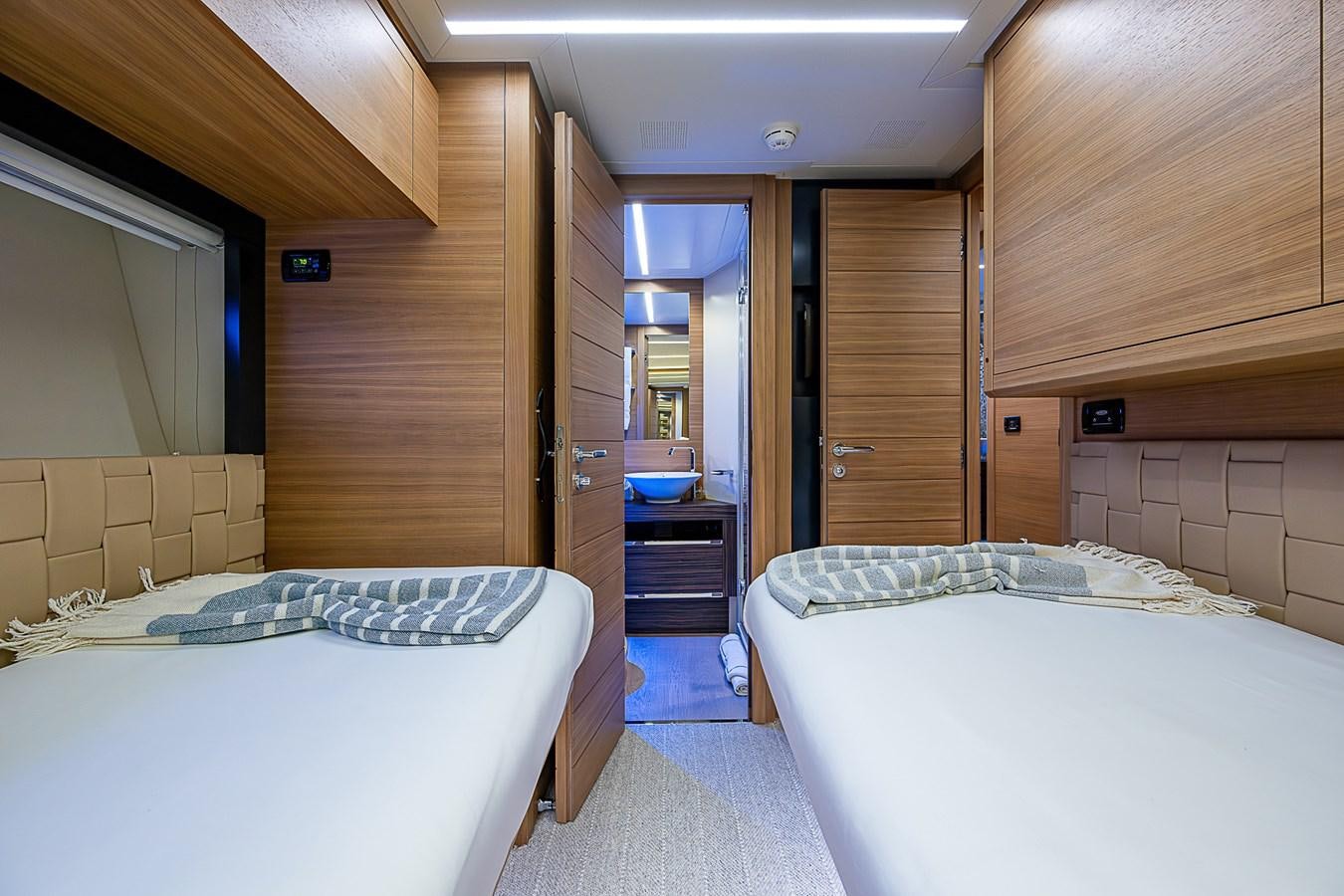 a room with two beds aboard COAL BLOODED Yacht for Sale