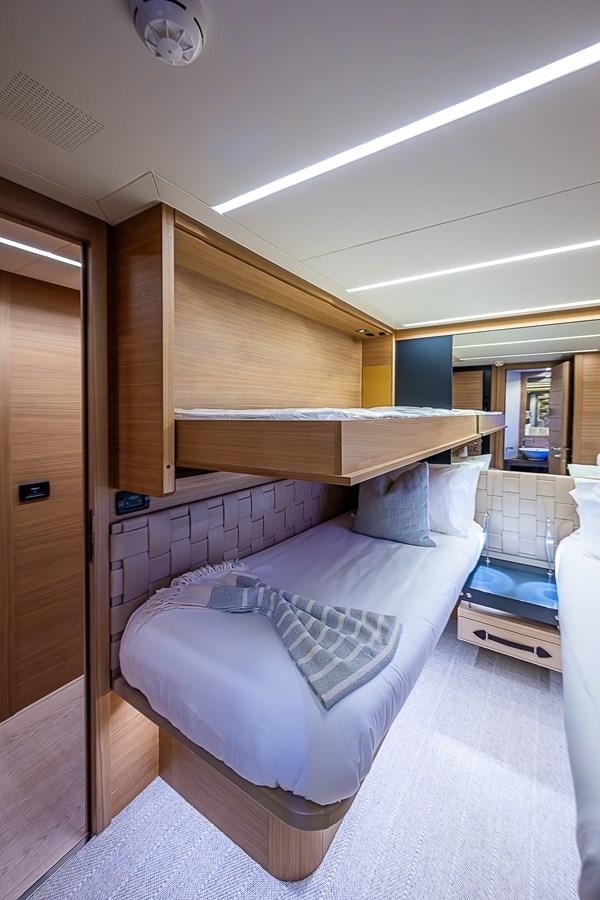 a bedroom with a bunk bed aboard COAL BLOODED Yacht for Sale