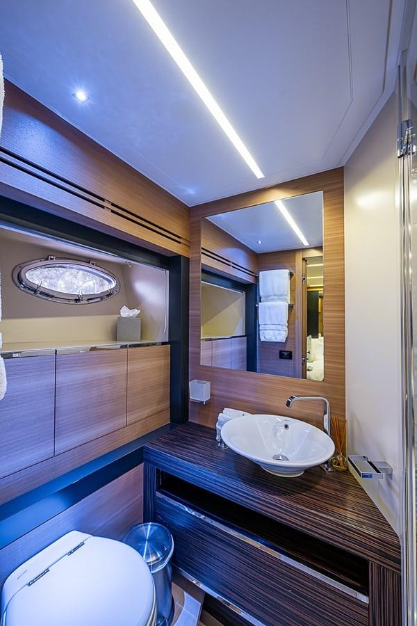 a bathroom with a sink and a mirror aboard COAL BLOODED Yacht for Sale