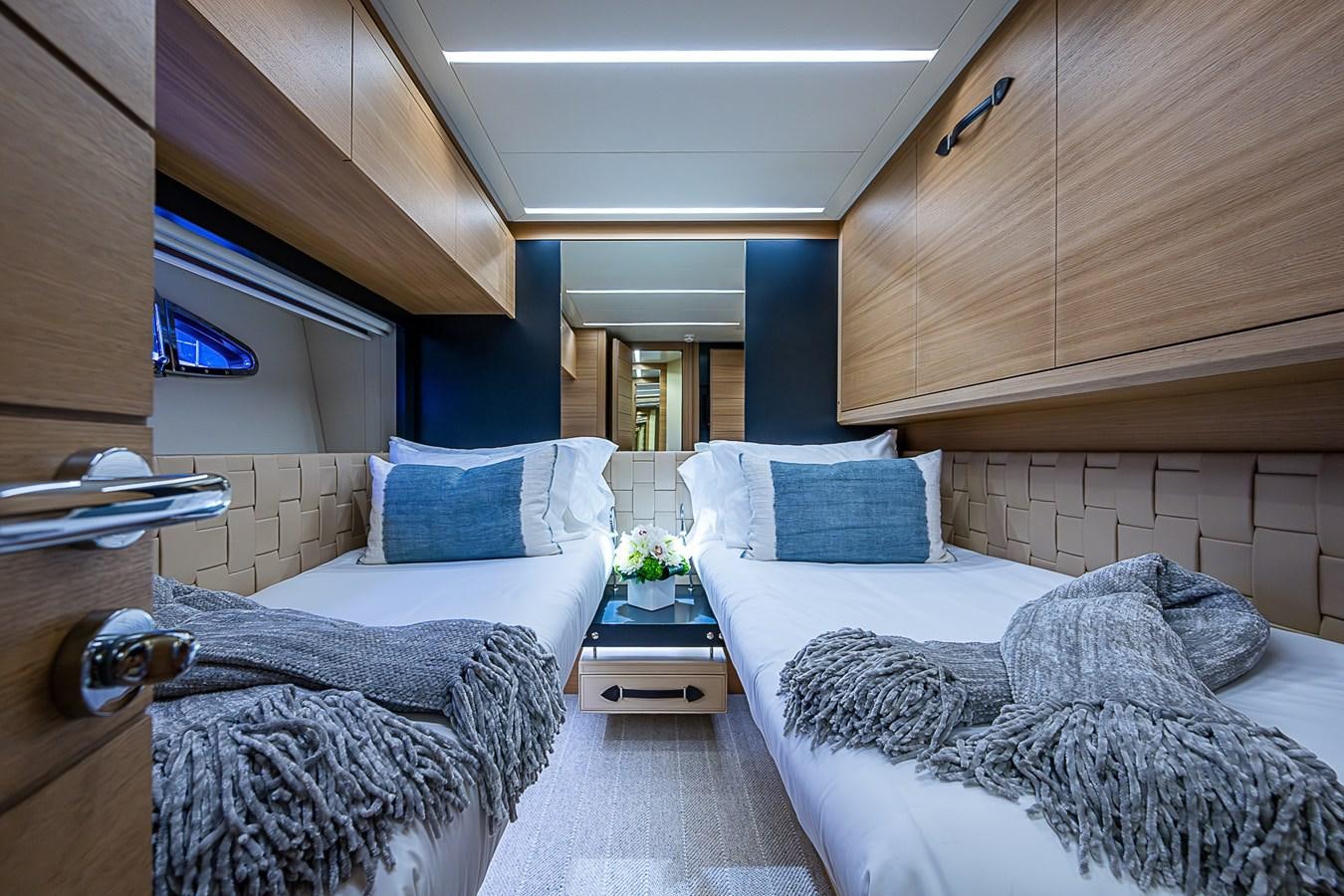 a room with two beds aboard COAL BLOODED Yacht for Sale
