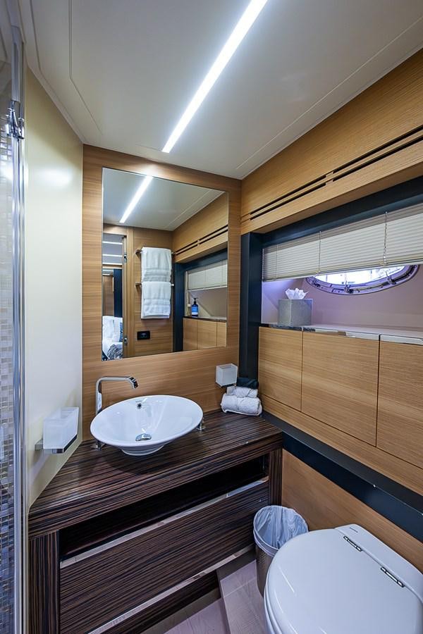 a bathroom with a sink and a mirror aboard COAL BLOODED Yacht for Sale
