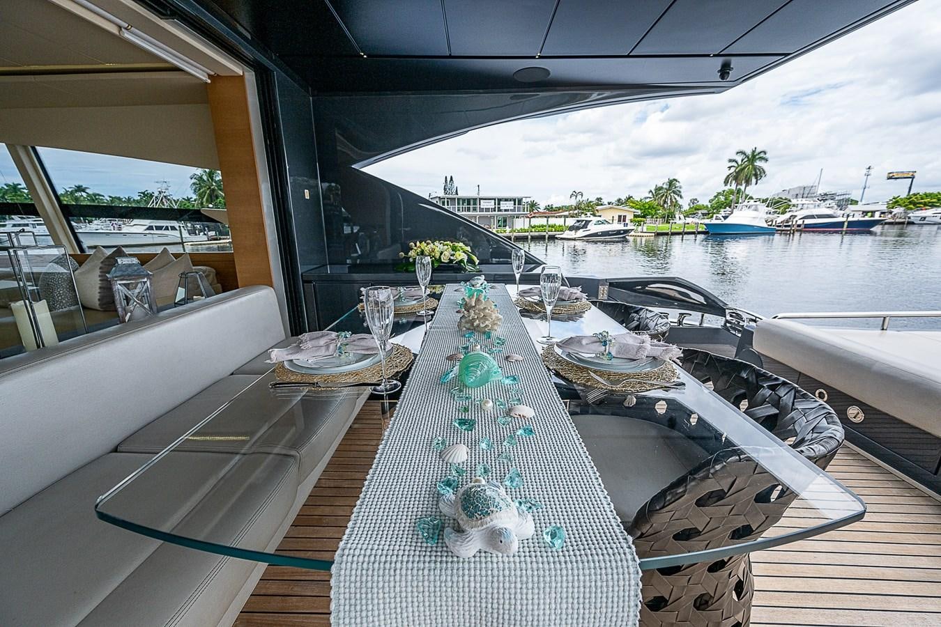 a table with plates and glasses on it aboard COAL BLOODED Yacht for Sale