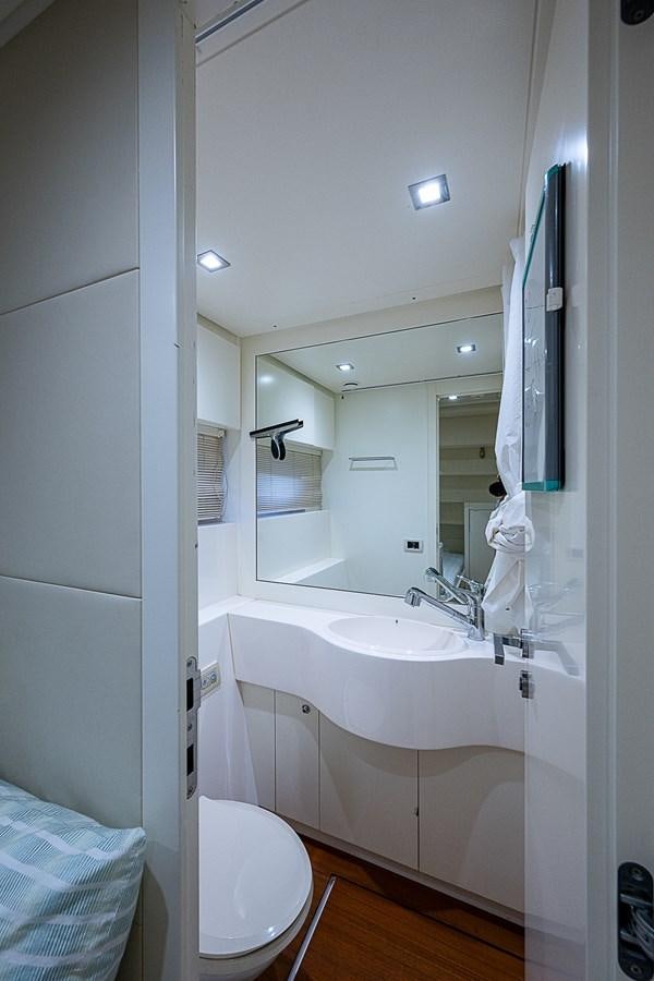 a bathroom with a sink and a toilet aboard COAL BLOODED Yacht for Sale