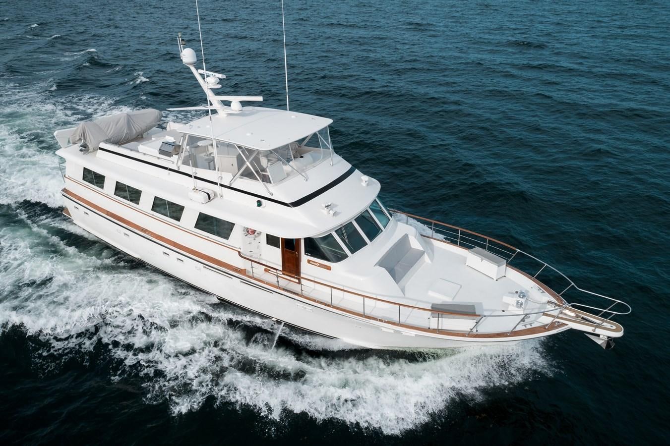 a white boat on the water aboard HIGH IMPACT Yacht for Sale