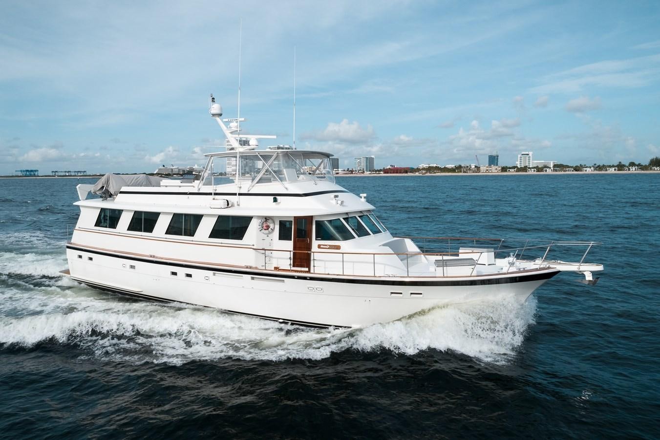 a white yacht on the water aboard HIGH IMPACT Yacht for Sale