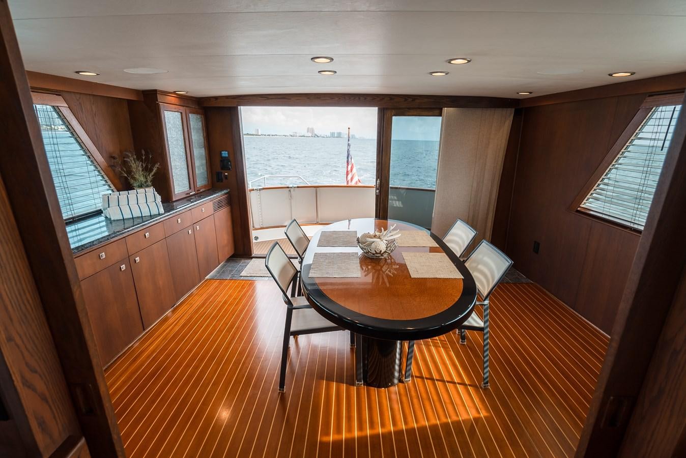 a dining table in a room aboard HIGH IMPACT Yacht for Sale