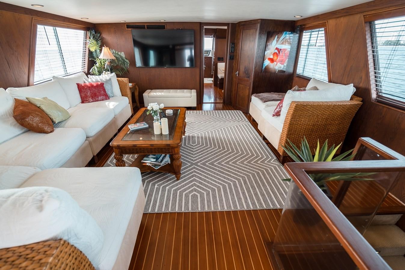 a room with a bed and a table aboard HIGH IMPACT Yacht for Sale