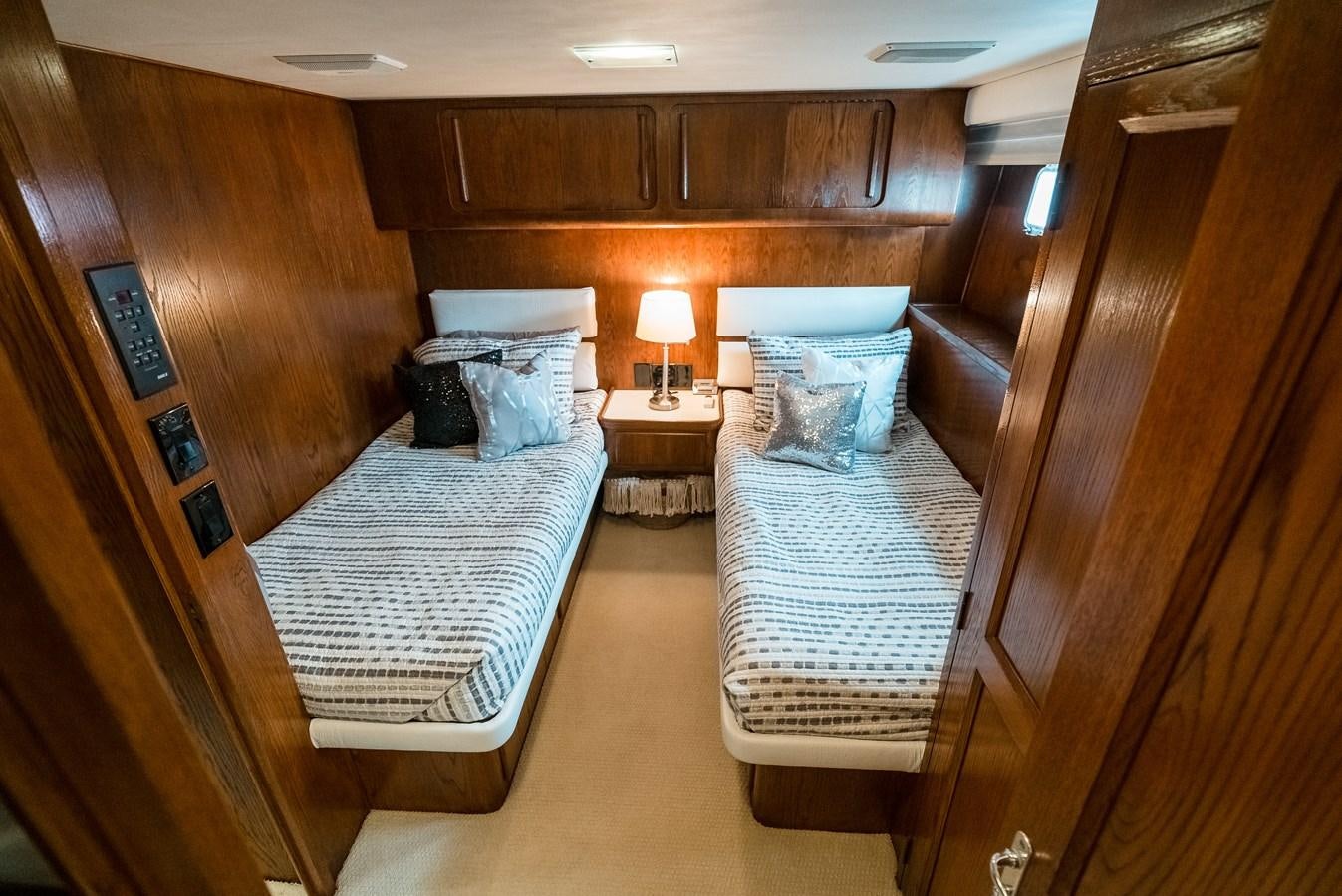 a room with a bed and a table aboard HIGH IMPACT Yacht for Sale