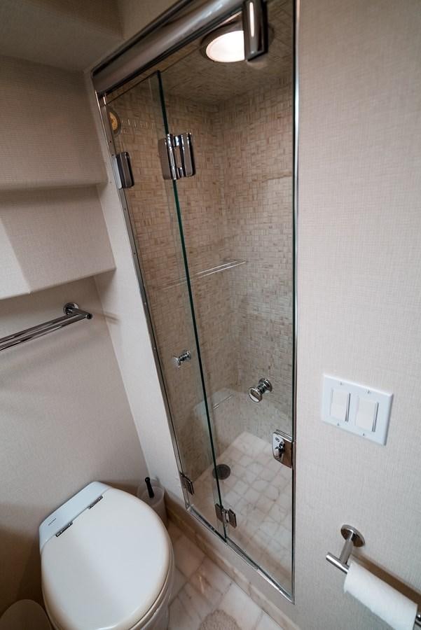 a shower unit with a glass door aboard HIGH IMPACT Yacht for Sale