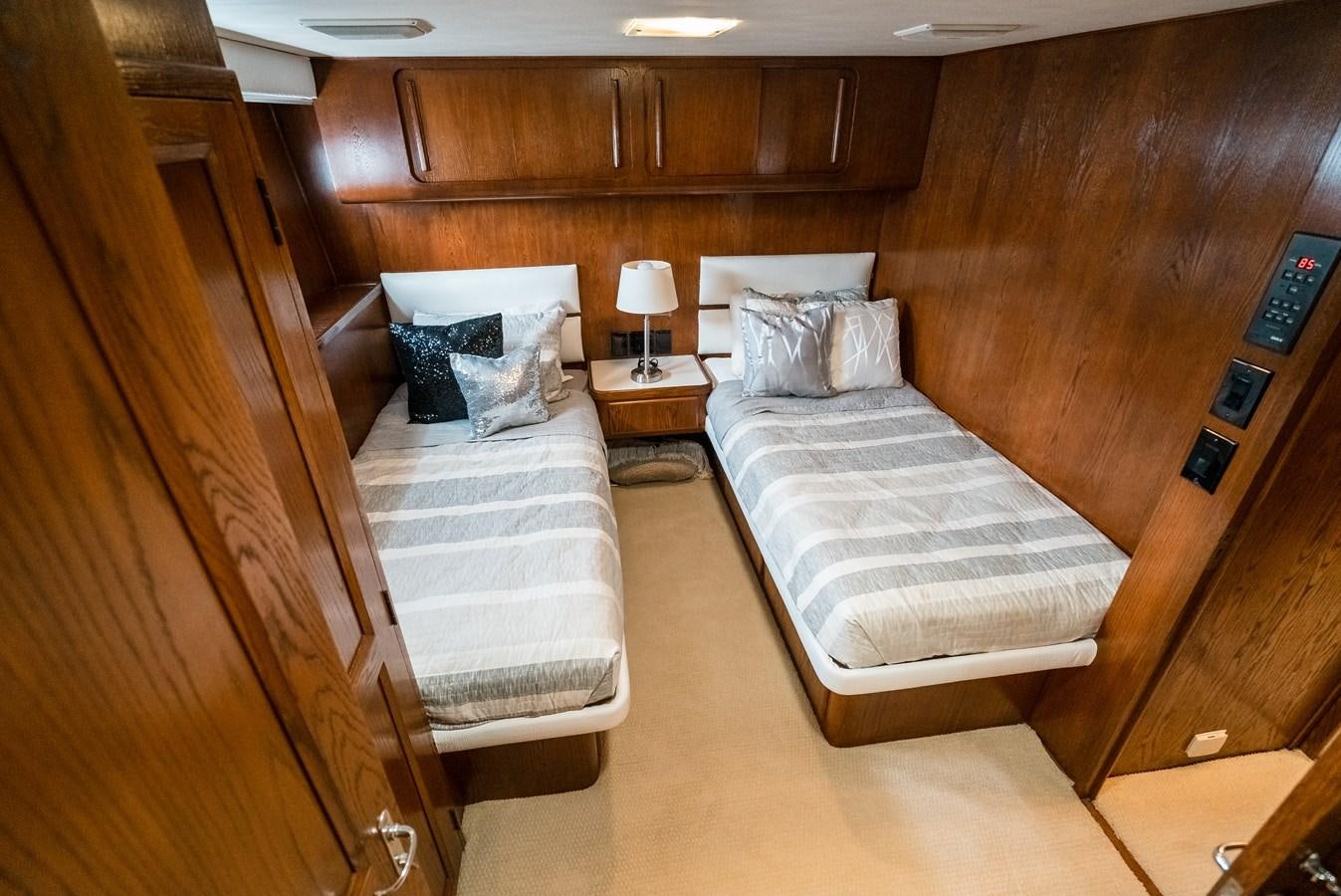 a room with two beds aboard HIGH IMPACT Yacht for Sale