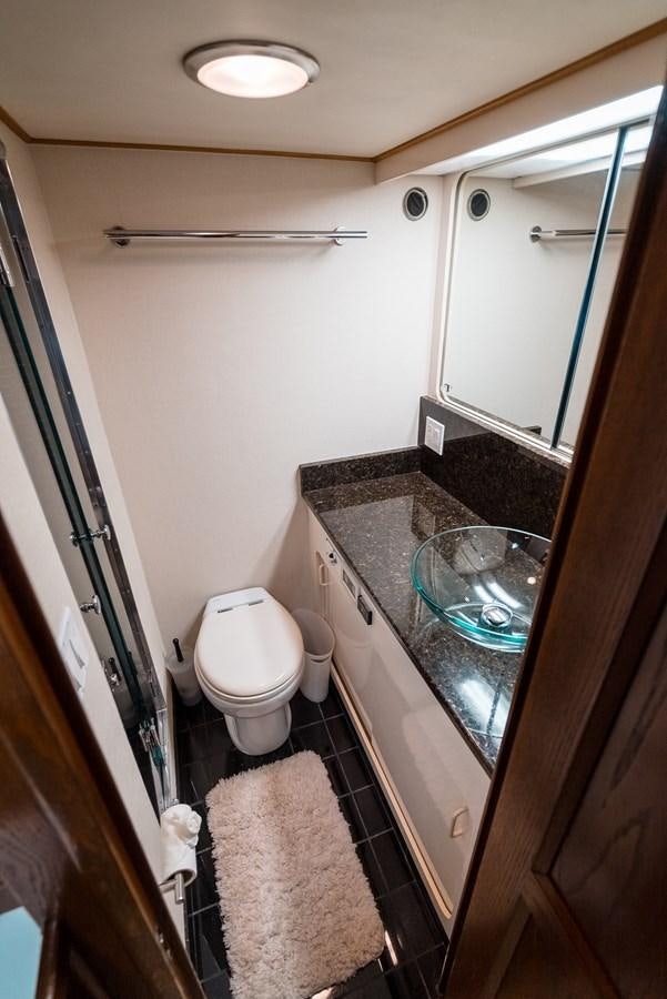 a bathroom with a glass shower aboard HIGH IMPACT Yacht for Sale
