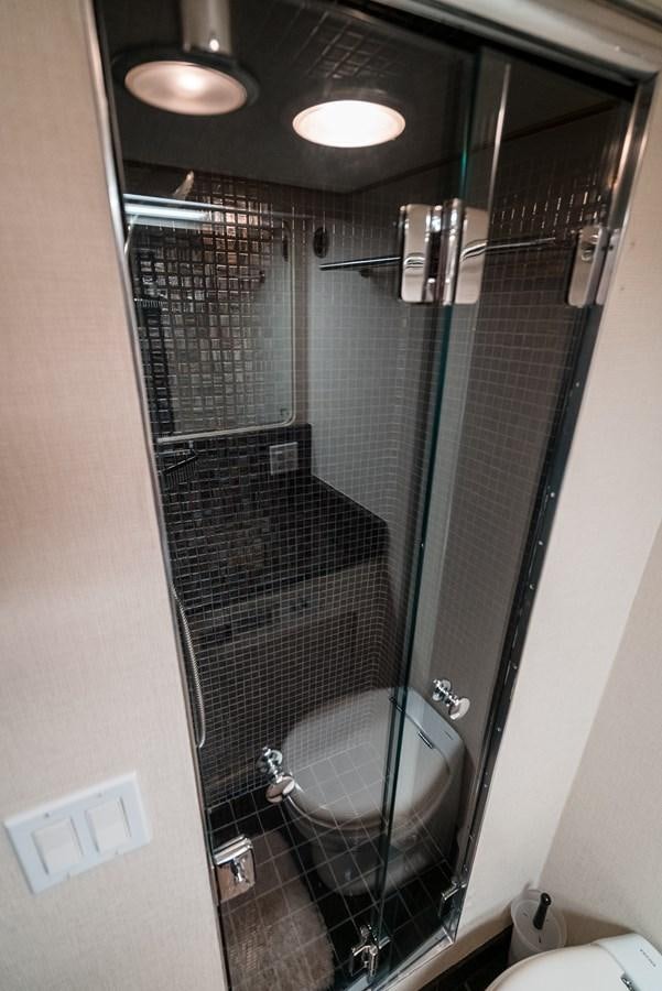 a shower unit with a glass door aboard HIGH IMPACT Yacht for Sale