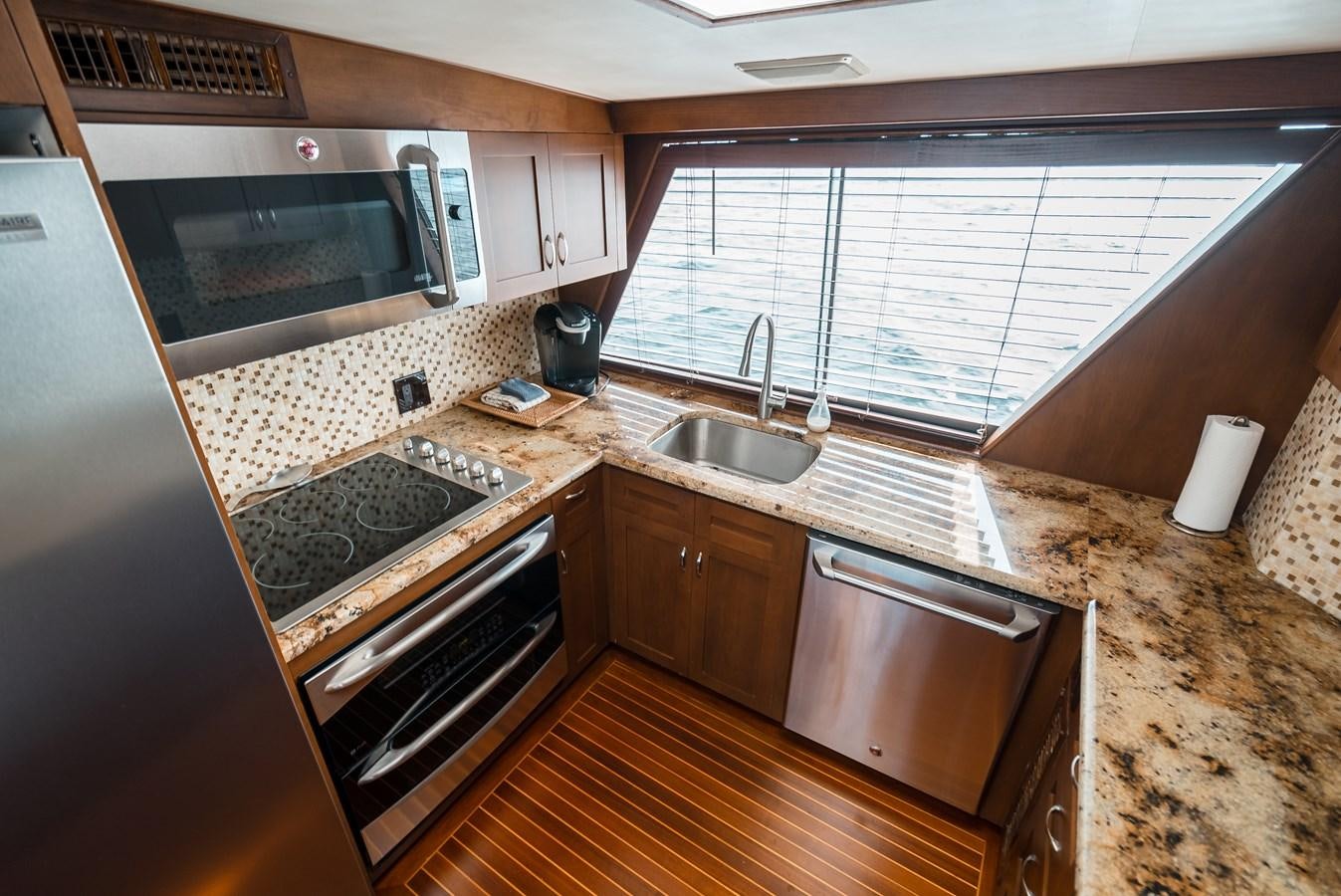 a kitchen with granite counter tops aboard HIGH IMPACT Yacht for Sale