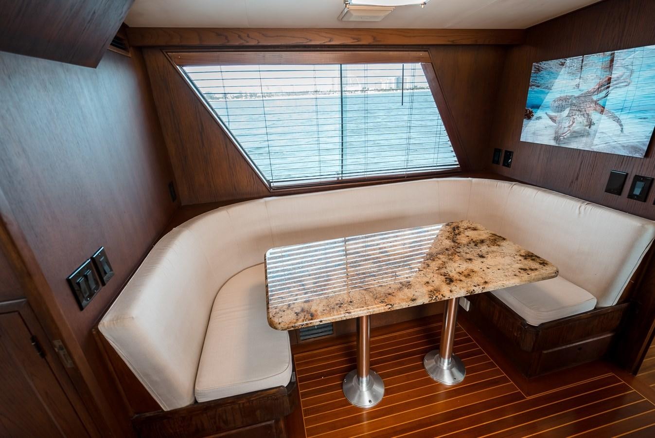 a room with a bed and a piano aboard HIGH IMPACT Yacht for Sale