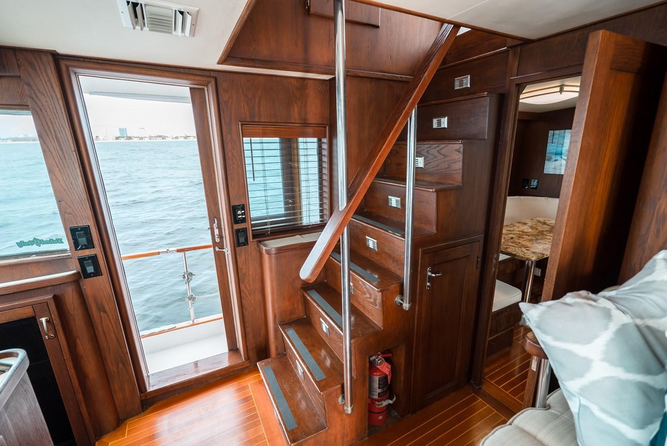 a wooden bunk bed in a room aboard HIGH IMPACT Yacht for Sale