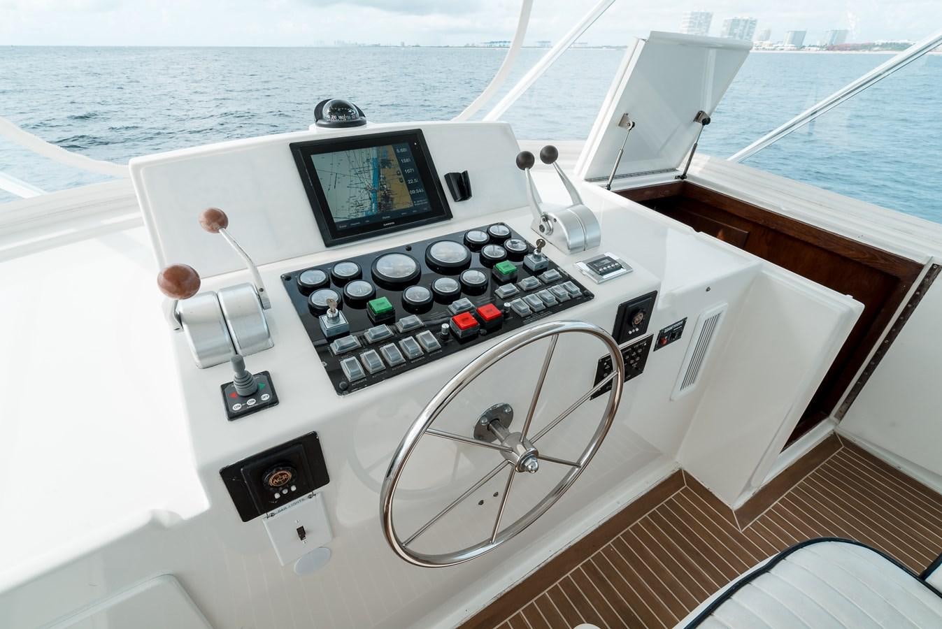 a boat with a control panel aboard HIGH IMPACT Yacht for Sale