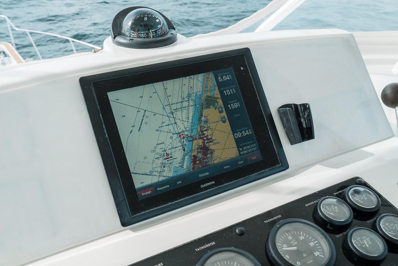 a tablet on a boat aboard HIGH IMPACT Yacht for Sale