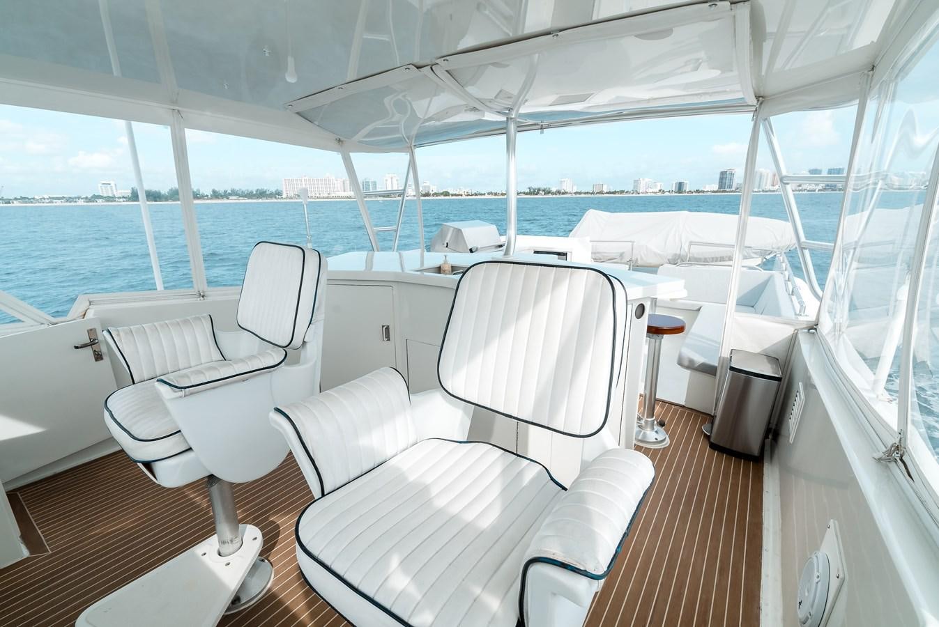 a boat with chairs and tables aboard HIGH IMPACT Yacht for Sale