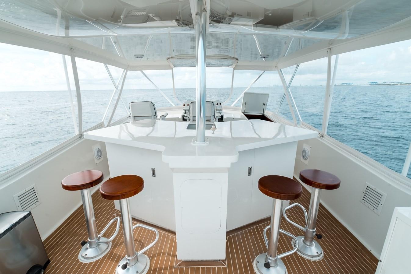 a boat with stools and stools aboard HIGH IMPACT Yacht for Sale