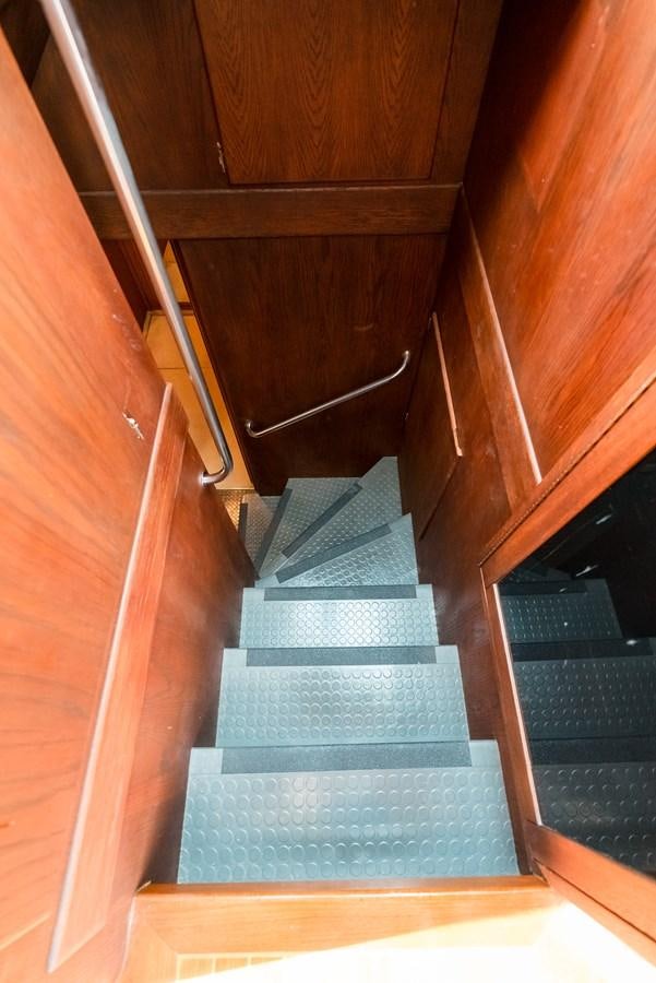 a staircase with a carpet aboard HIGH IMPACT Yacht for Sale