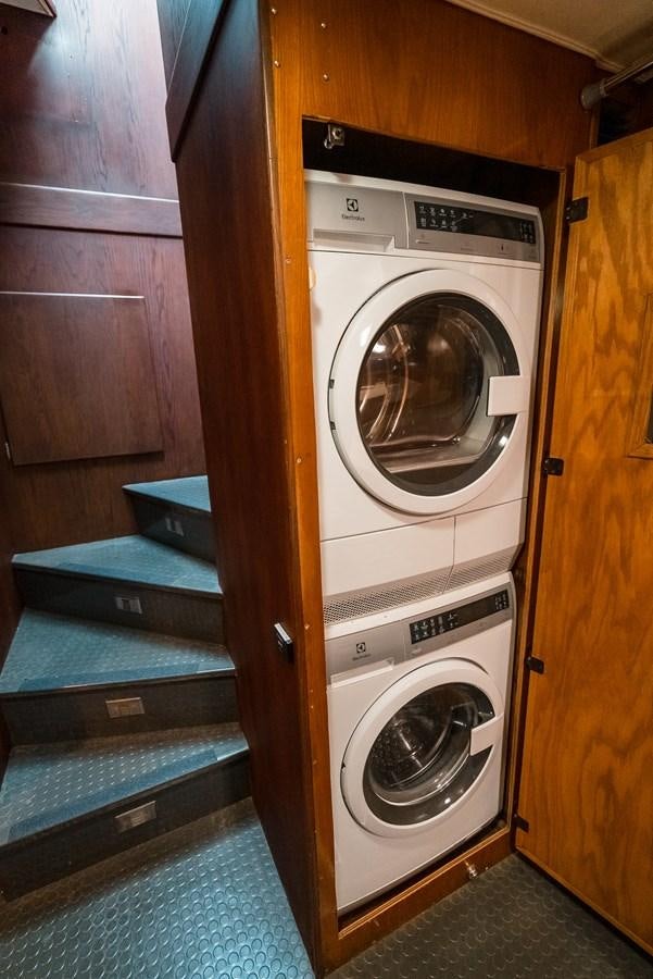a washer and dryer in a room aboard HIGH IMPACT Yacht for Sale