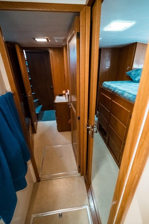 a room with a wood door and a mirror aboard HIGH IMPACT Yacht for Sale