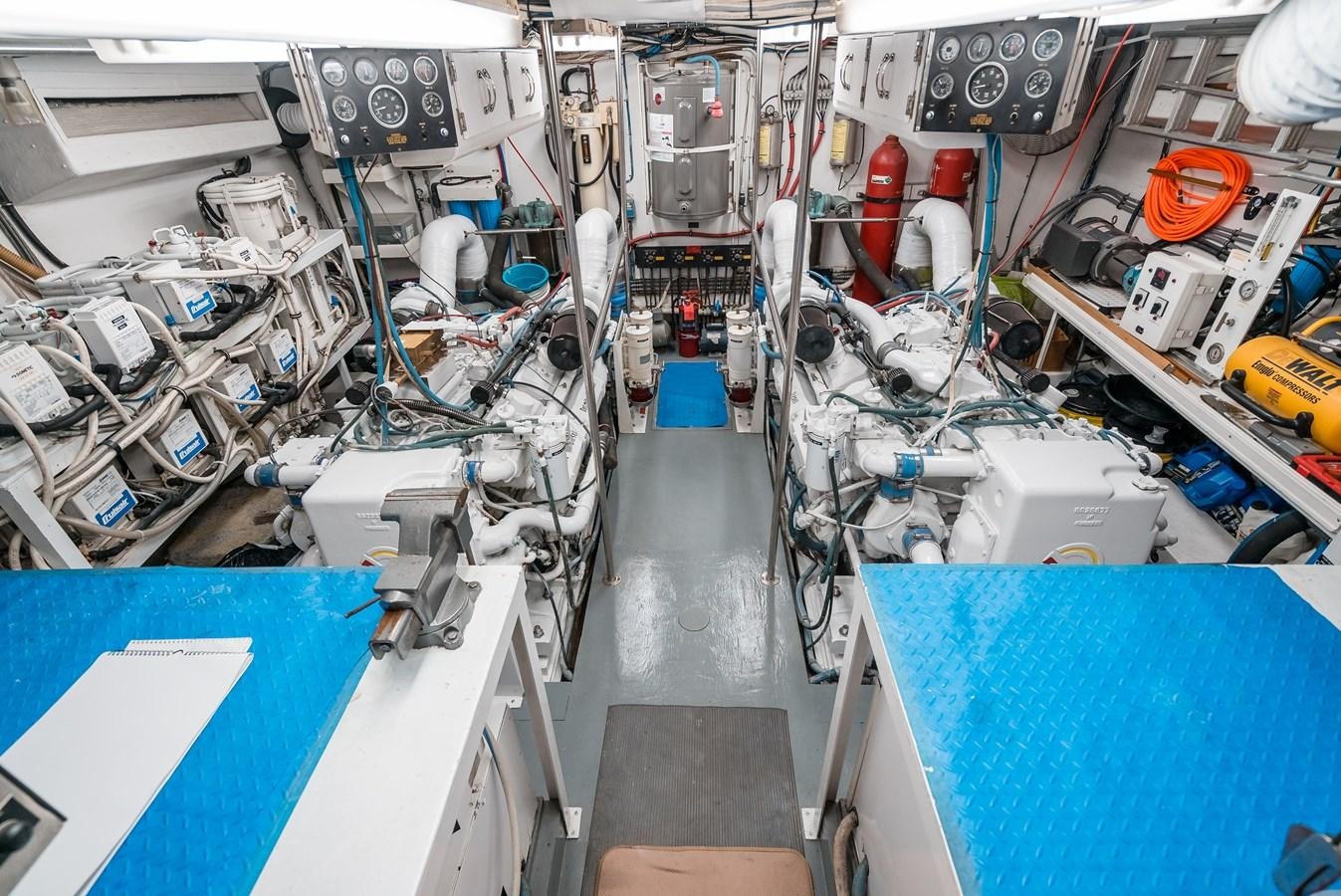 a room with a blue table and white walls and a blue table with a blue tablecloth and aboard HIGH IMPACT Yacht for Sale