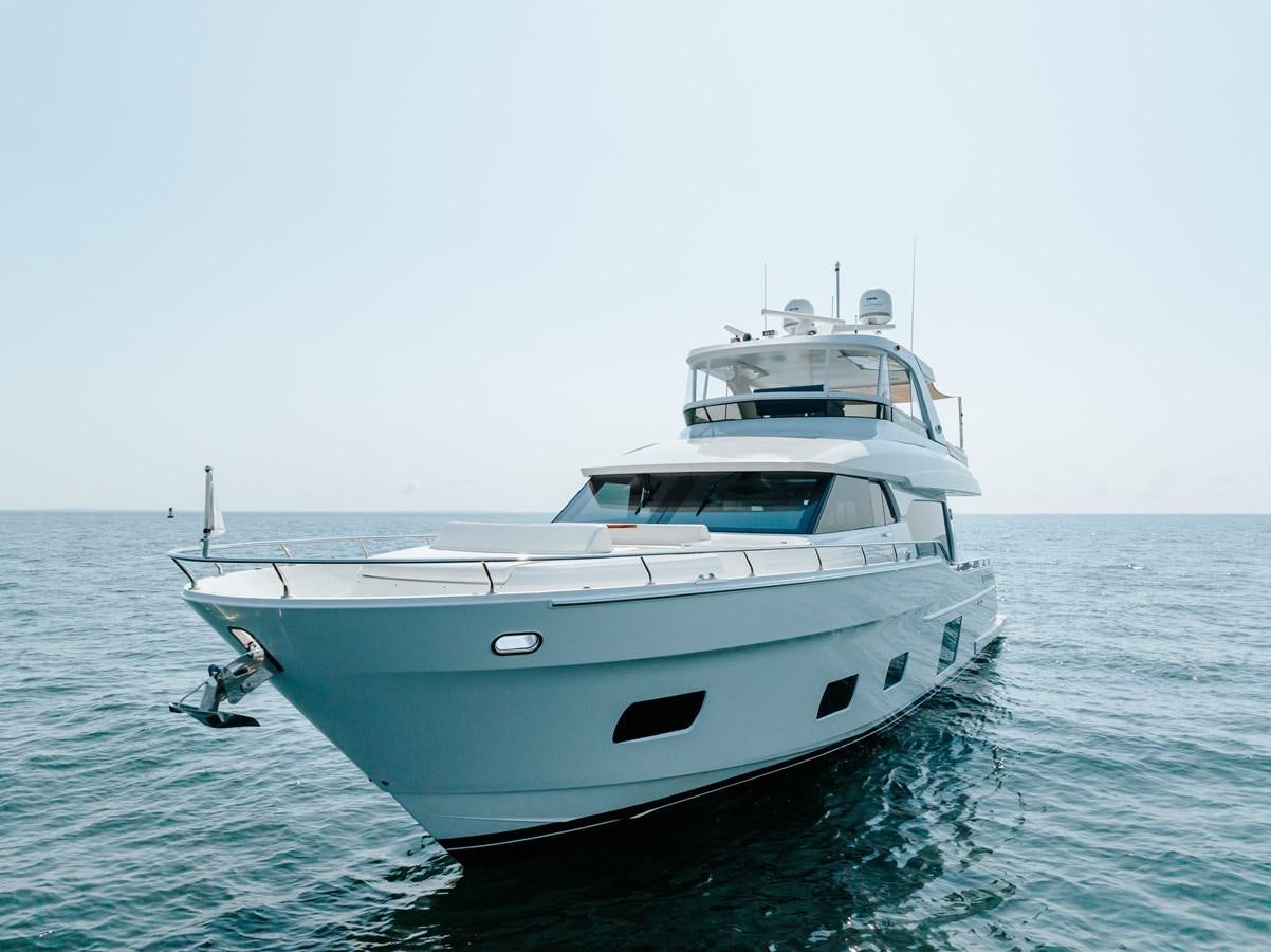 a white yacht in the water aboard THE THREE B'S Yacht for Sale