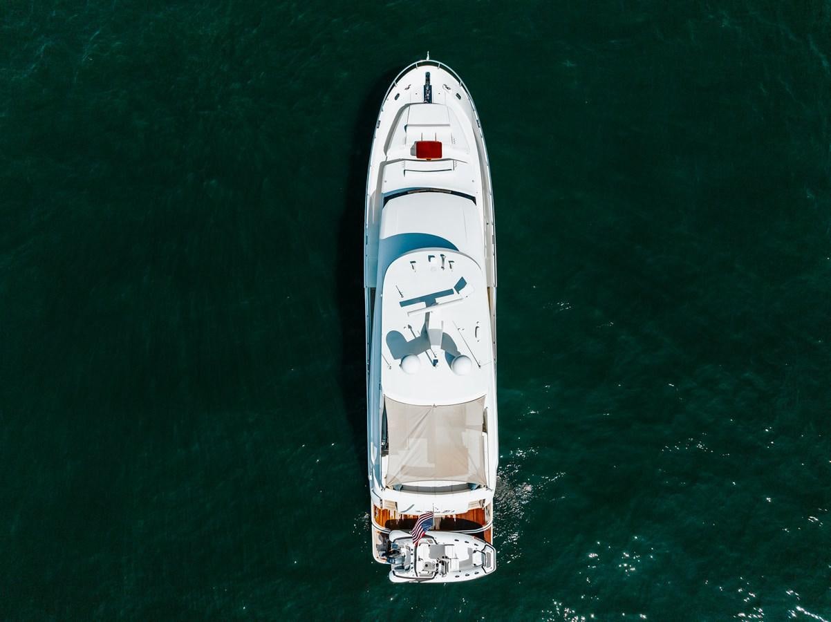 a white and blue ship in the water aboard THE THREE B'S Yacht for Sale