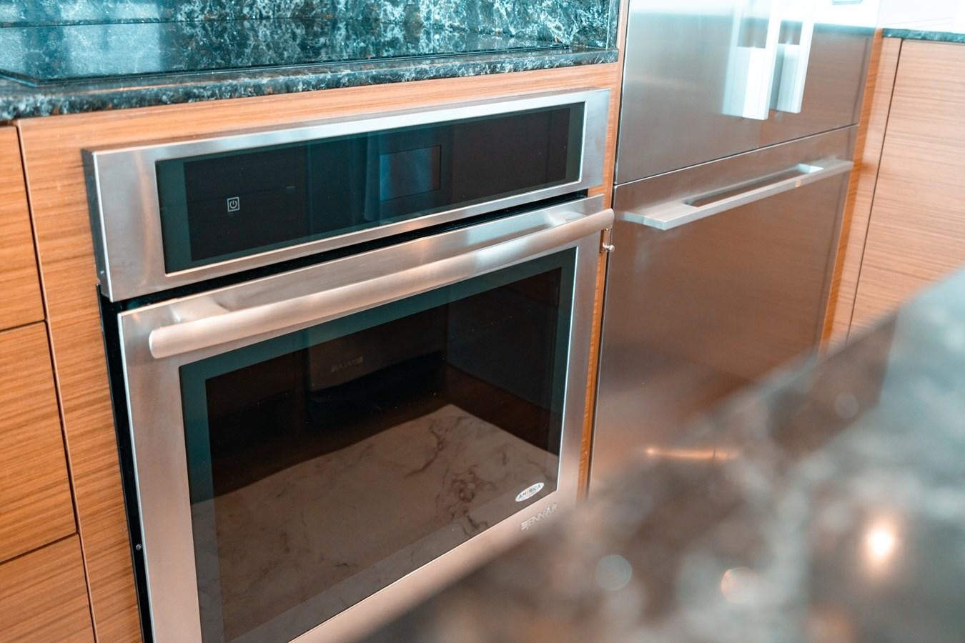 a kitchen with a microwave oven aboard THE THREE B'S Yacht for Sale