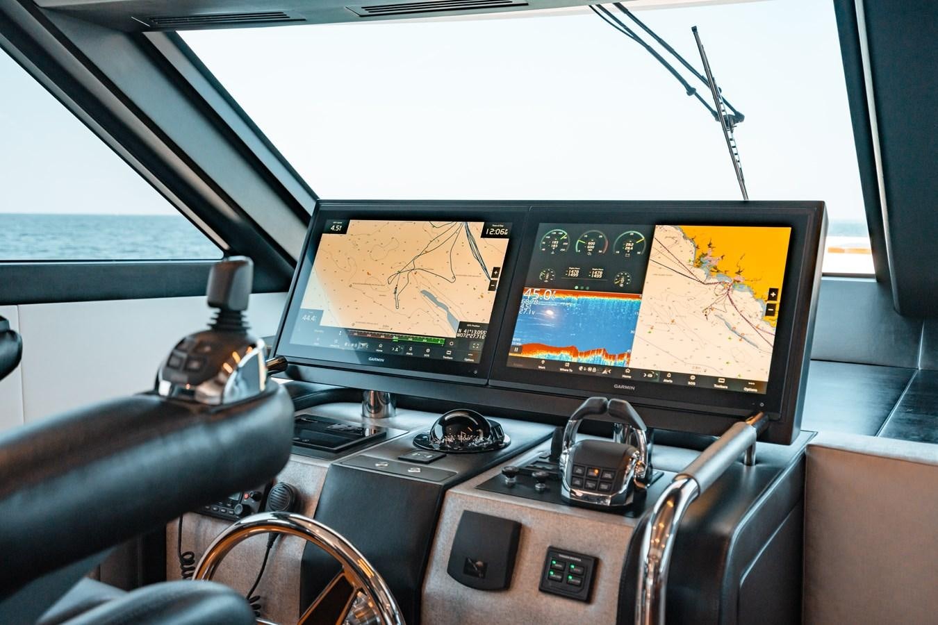 a desk with a couple of computers on it aboard THE THREE B'S Yacht for Sale