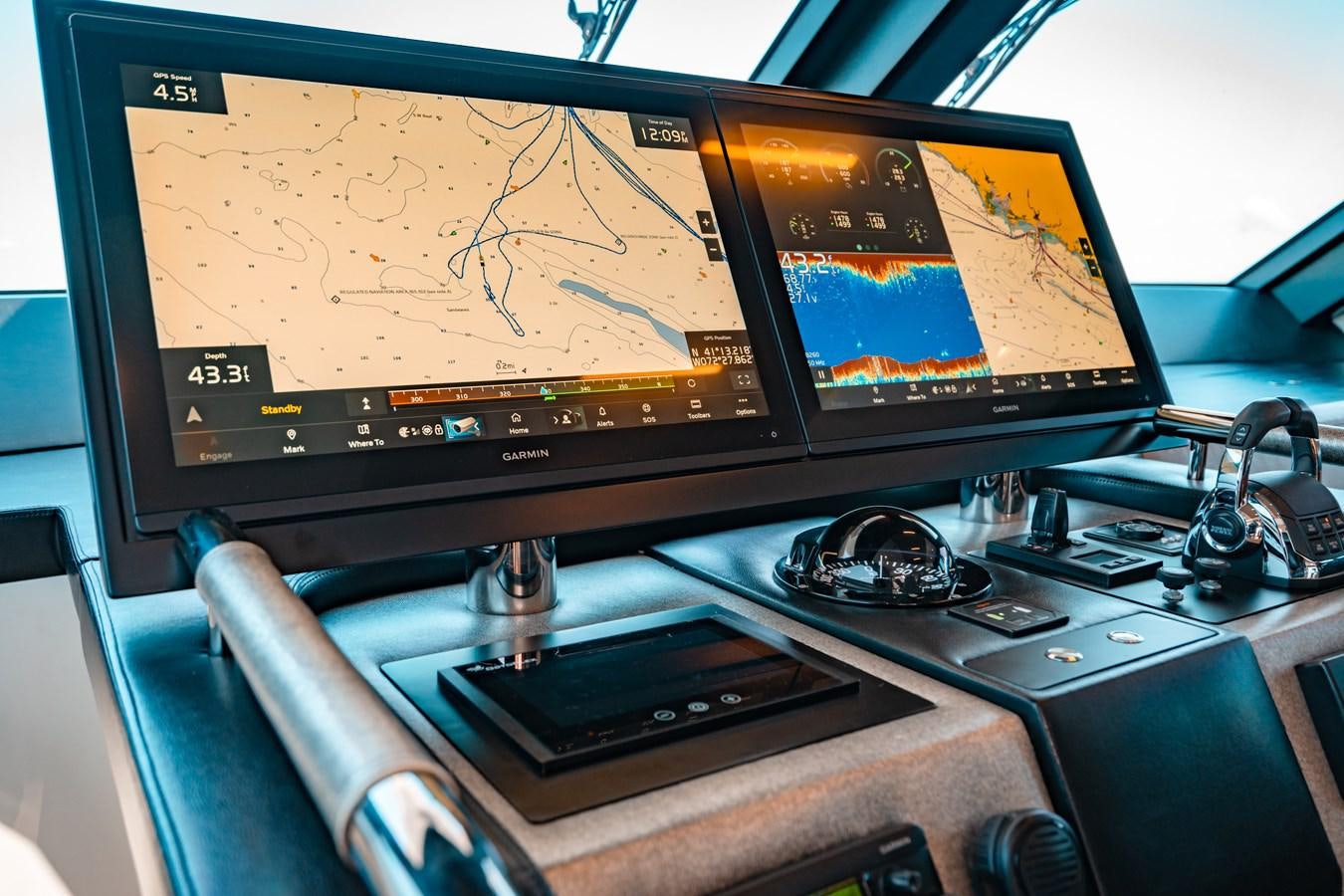 a desk with a computer and a monitor aboard THE THREE B'S Yacht for Sale