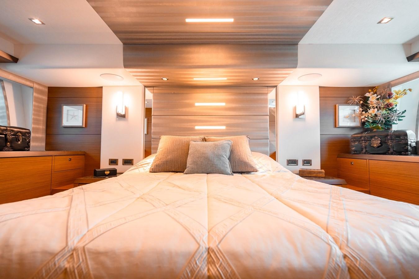 a bed with a brown comforter aboard THE THREE B'S Yacht for Sale