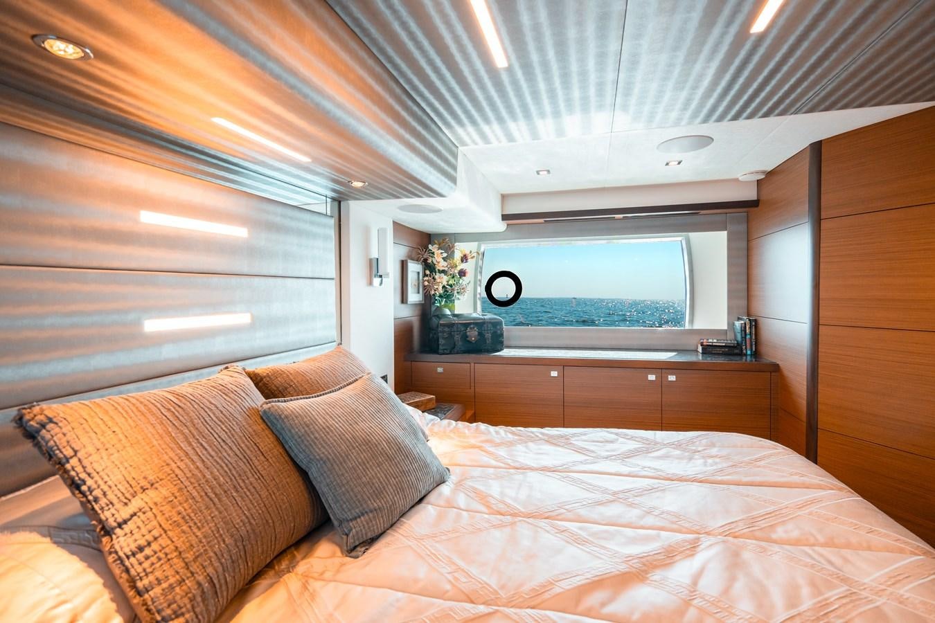 a bed with a mirror above it aboard THE THREE B'S Yacht for Sale