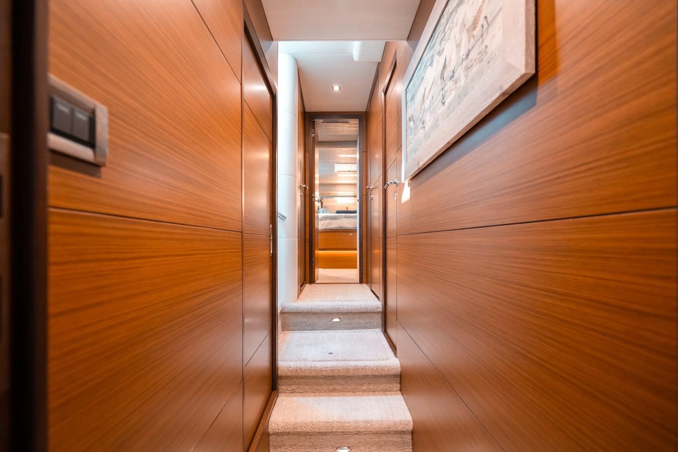 a hallway with wood walls aboard THE THREE B'S Yacht for Sale