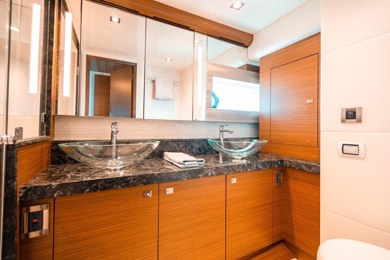 a bathroom with a glass bowl aboard THE THREE B'S Yacht for Sale