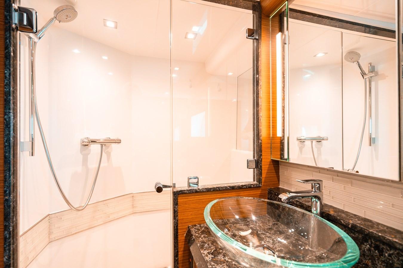 a bathroom with a sink and a shower aboard THE THREE B'S Yacht for Sale